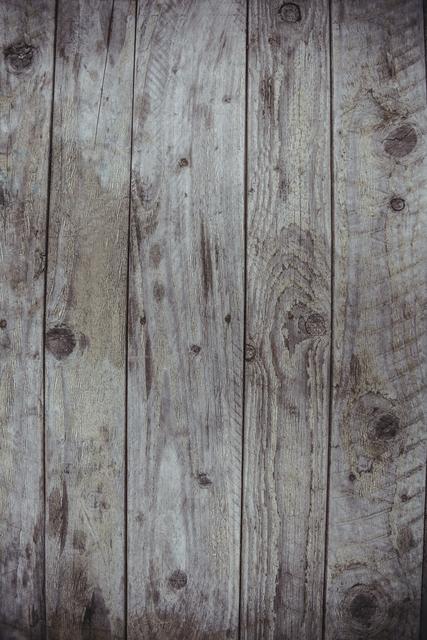 Rustic weathered wooden planks create a natural, vintage texture background. Perfect for use in designs, crafts, websites, or print materials where a rustic or aged effect is desired. Ideal for backgrounds in presentations, flyers, posters, or social media graphics.