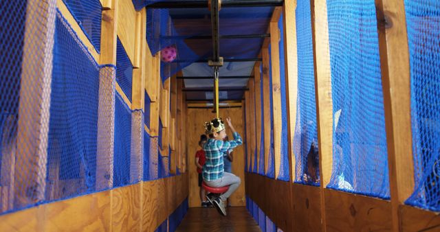 Child Riding Zip Line in Indoor Adventure Playground - Download Free Stock Images Pikwizard.com