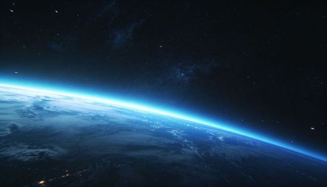 Orbiting earthlike horizon revealing blue atmospheric glow, cloud layers and milky way