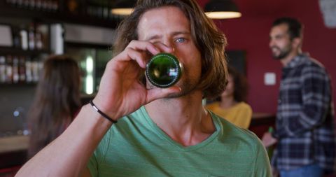 Casual Man Drinking Beer at Cozy Bar