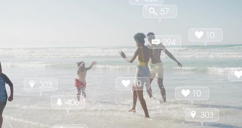 Family splashing on beach with social media notification overlay, summer lifestyle