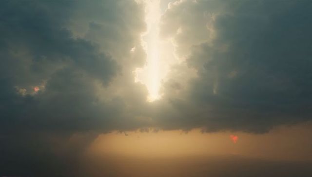 Dramatic Skyscape with Sunbeam and Golden Haze