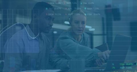Business team analyzing financial charts on laptop for data-driven decisions