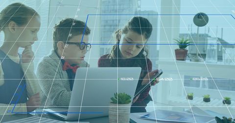 Innovative Young Minds Analyzing Financial Data in Modern Office