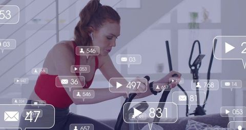 Redheaded woman cycling on exercise bike wearing earbuds with social engagement overlays