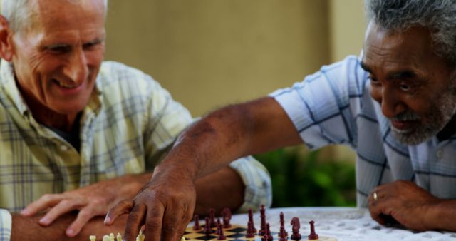 Two Senior Men Playing Chess with Laughs and Joy - Download Free Stock Images Pikwizard.com