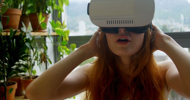Redhead Woman Experiencing Virtual Reality in Home Garden - Download Free Stock Images Pikwizard.com
