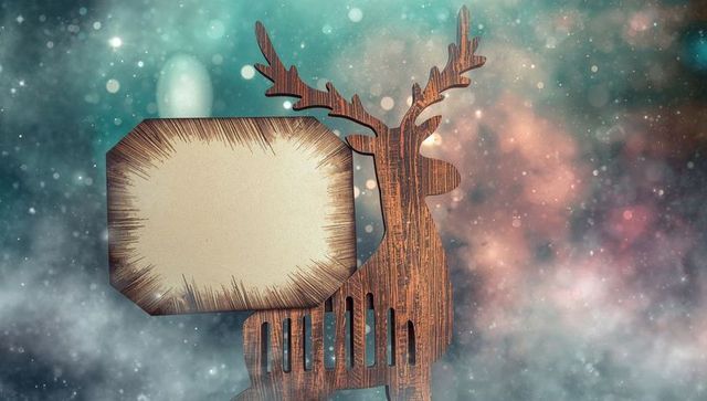 Wooden deer silhouette with blank sign on mystical cosmic background