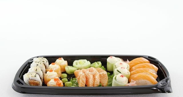 Assorted Sushi Platter with Fresh Nigiri and Rolls in Black Takeout Tray - Download Free Stock Images Pikwizard.com