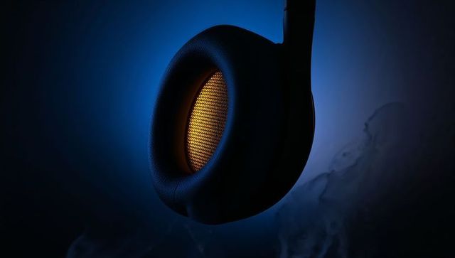 Glowing amber mesh over-ear headphone earcup with padded cushion, blue backlight, smoke