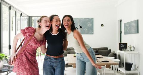 Excited Female Friends Celebrating Graduation Together