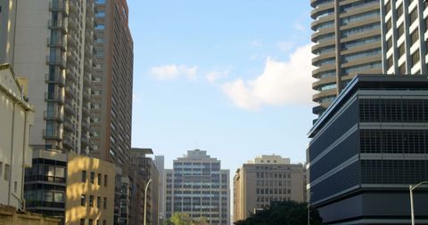 Urban Cityscape Under Clear Blue Sky Featuring Tall Buildings - Download Free Stock Images Pikwizard.com