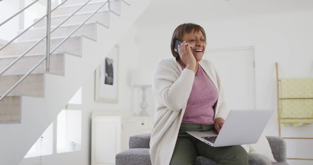 Senior Woman on Phone Working with Laptop in Modern Home - Download Free Stock Images Pikwizard.com