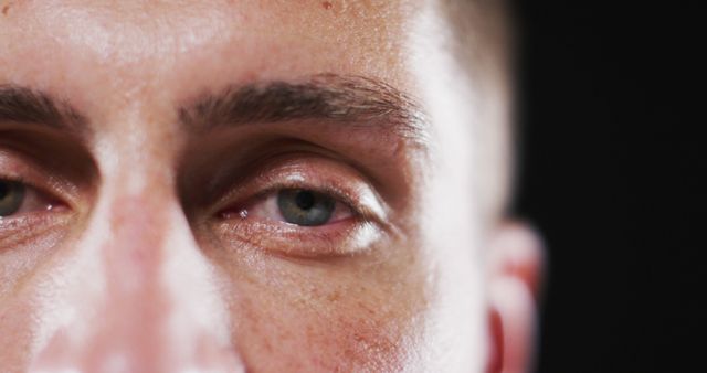 Close up portrait of face of caucasian man with focus on blinking eye. human vision and sight, eye detail.