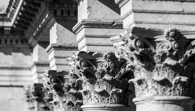 Corinthian capitals showcasing acanthus carvings and volutes on classical colonnade