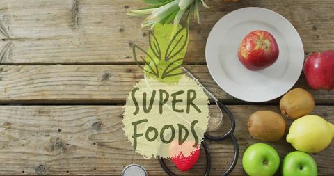 Superfoods flatlay with stethoscope on rustic wood wellness nutrition and healthy living
