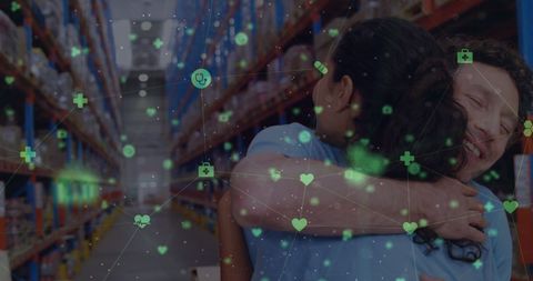 Happy Warehouse Workers Embracing with Floating Icons - Download Free Stock Images Pikwizard.com