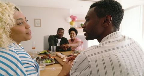 Joyful Friends Celebrating and Laughing at Festive Gathering