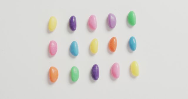 Colorful Assorted Jelly Beans Arranged in Rows on White Background - Download Free Stock Images Pikwizard.com