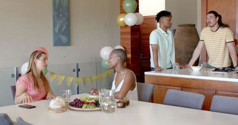 Friends Socializing During Casual Home Gathering