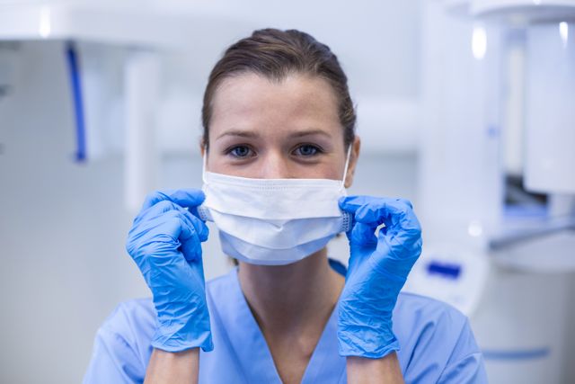 Portrait of dental assistant wearing surgical mask in dental clinic