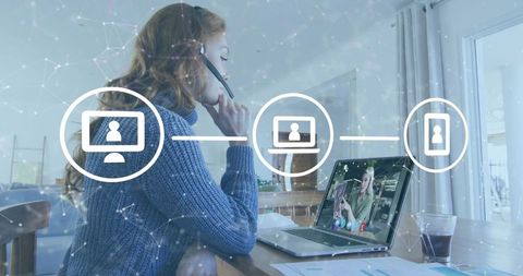 Remote consultant wearing headset working on laptop from home with collaboration icons