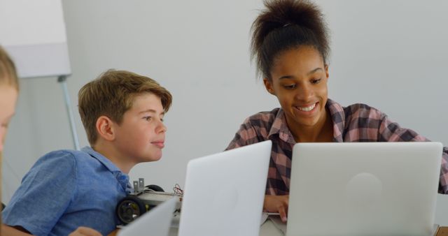 Diverse Students Collaborating on Laptops in Classroom - Download Free Stock Images Pikwizard.com