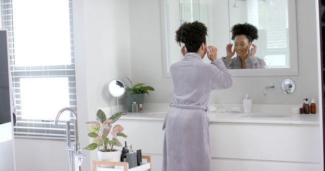 Woman Preparing for Day in Modern Bathroom - Download Free Stock Images Pikwizard.com