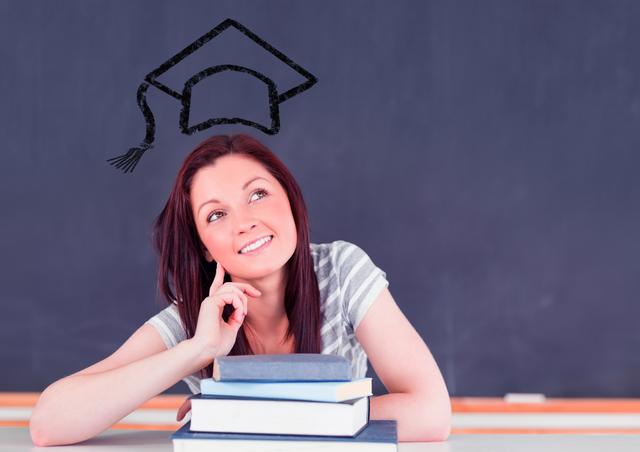 Thoughtful Woman in Classroom with Books and Graduation Cap - Download Free Stock Photos Pikwizard.com