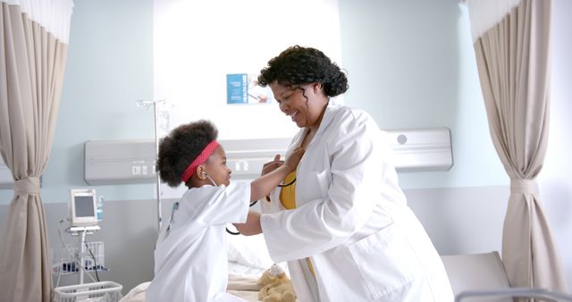 Smiling Female Doctor with Young Patient in Hospital Room - Download Free Stock Images Pikwizard.com