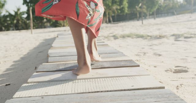 Low section of biracial woman walking on beach - Download Free Stock Photos Pikwizard.com
