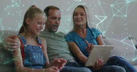 Parents and daughter exploring augmented reality on tablet with holographic data overlay