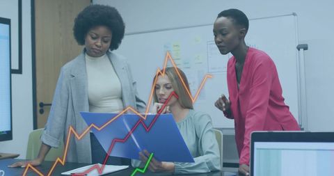 Diverse Team Analyzing Financial Analytics in Modern Office