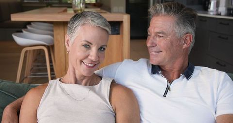 Senior Couple Relaxing Together in Modern Living Space