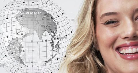 Smiling woman turning toward digital globe with data grid and global network concept