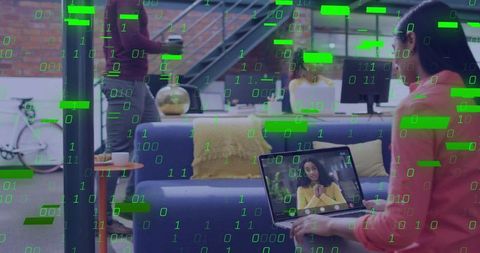 Hybrid office video call connecting remote team in modern coworking lounge with laptop