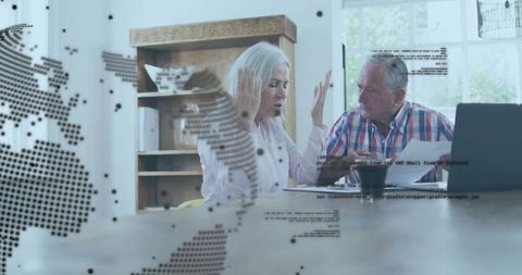 Senior Professionals Discussing Work in Modern Home Office