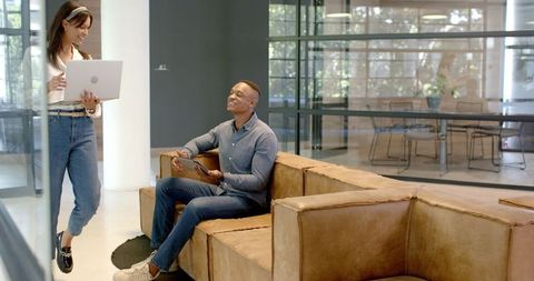 Diverse colleagues brainstorming in modern office setting