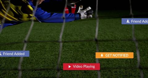 Goalkeeper diving save on green field with digital overlays