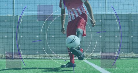 Youth Soccer Player Kicking Ball in Dynamic Action