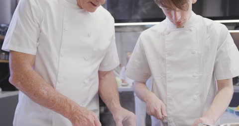 Experienced Chefs Collaborate in Professional Kitchen Cookery Class
