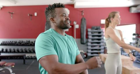 African American Man and Caucasian Woman Exercising at Gym - Download Free Stock Images Pikwizard.com