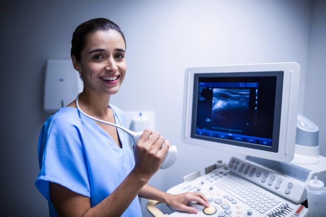 Smiling Nurse Using Ultrasound Machine in Hospital - Download Free Stock Photos Pikwizard.com