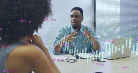 Business Coworkers Analyzing Financial Data with Overlayed Graphs