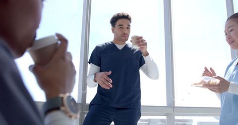 Healthcare professionals relaxing during coffee break at hospital