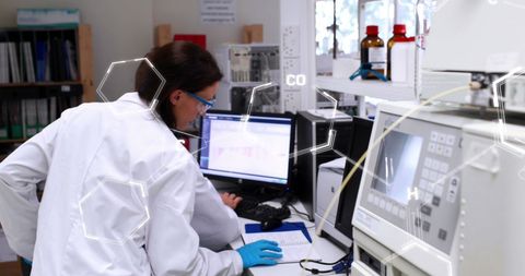 Focused Female Lab Technician Exploring Data in Scientific Facility - Download Free Stock Images Pikwizard.com