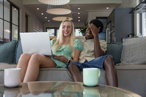 Happy Couple Bonding at Home Potraying Relaxed Modern Lifestyle