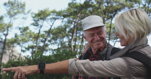 Senior Couple Smiling and Hiking Together in Forest - Download Free Stock Images Pikwizard.com