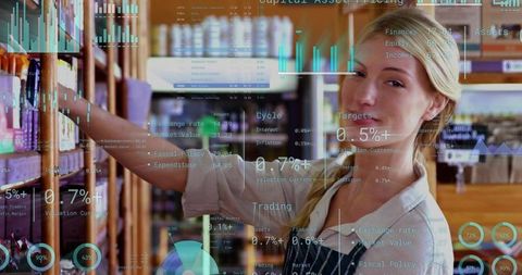 Woman stocking shelves with jars while digital sales analytics overlaying shop interior