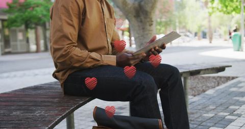 Young Man Reading Together in Tranquil Park Setting